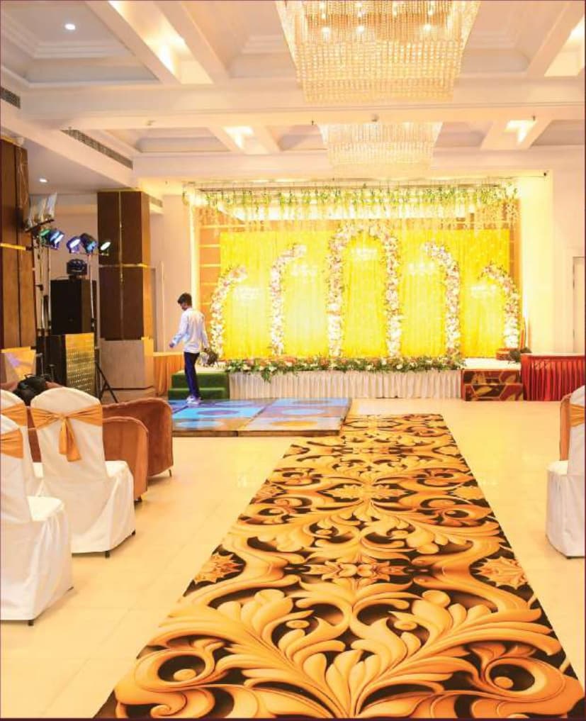 Crystal Hall with Yellow Floral Decor and Royal Carpet