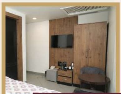 Nakshatra Hotel Room Interior with Smart TV and Desk