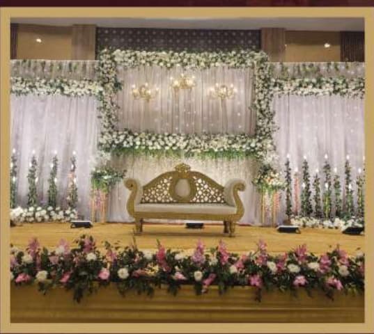 Nakshatra Hotel Wedding Stage Floral Decor and Royal Seating
